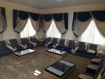Deep Navy Blue Traditional Diwan Majlis with Intricate Gold Trim Accents