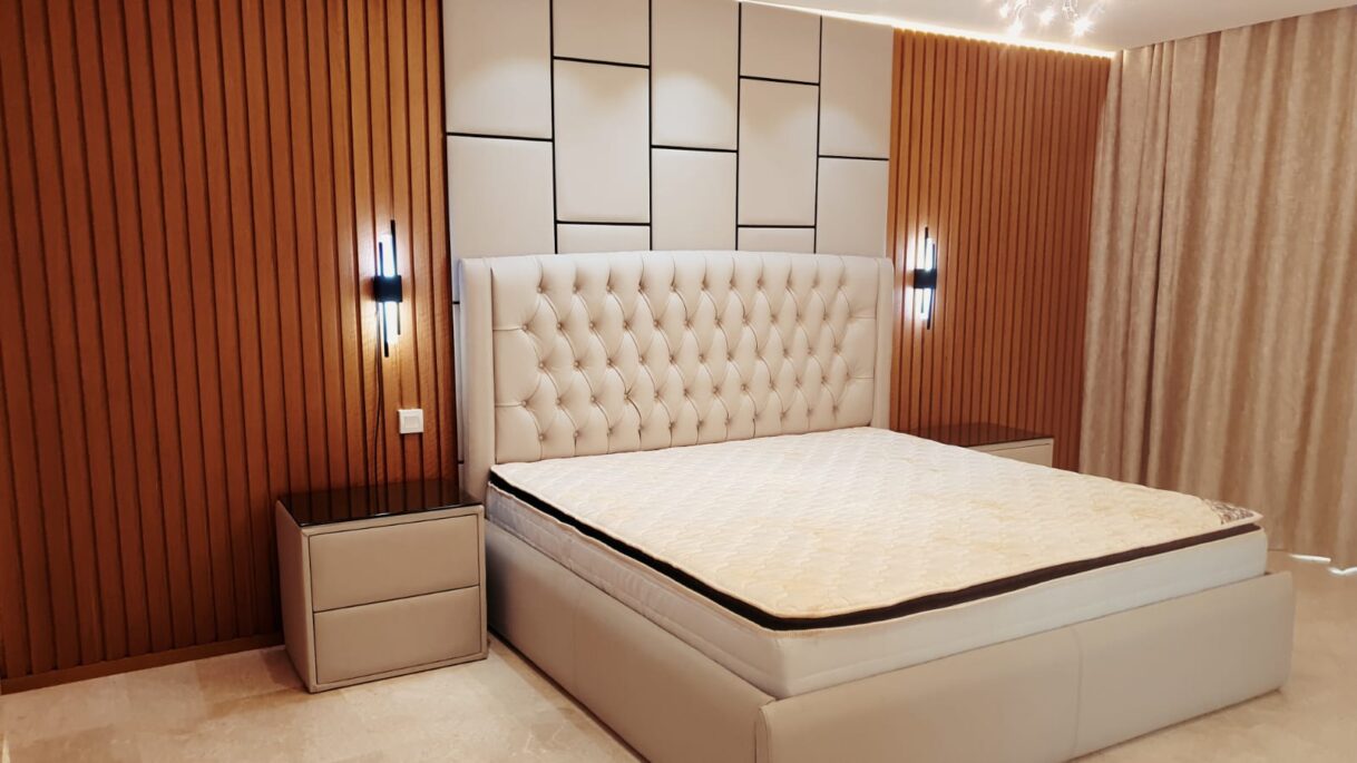 Luxury Dual-Texture Bedroom Feature Wall with Fluted Wood and Upholstered Geometric Paneling