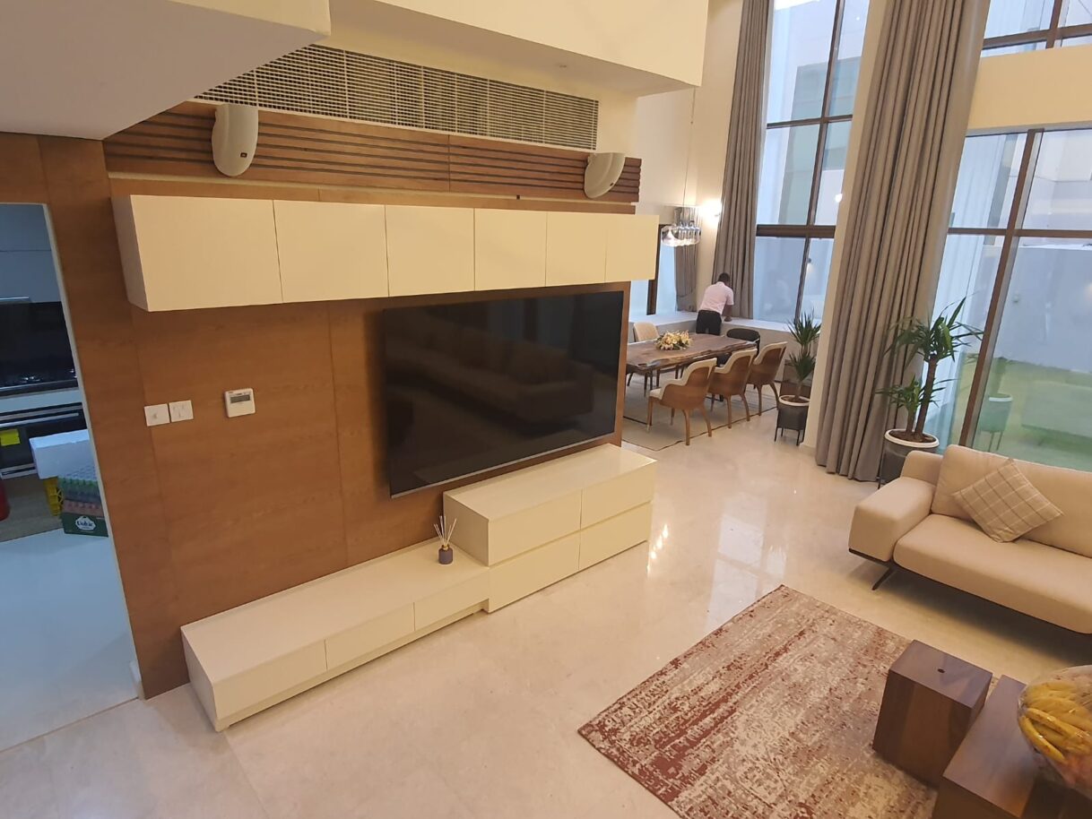 Modern Minimalist Floating White TV Console with Warm Wood Backdrop paneling